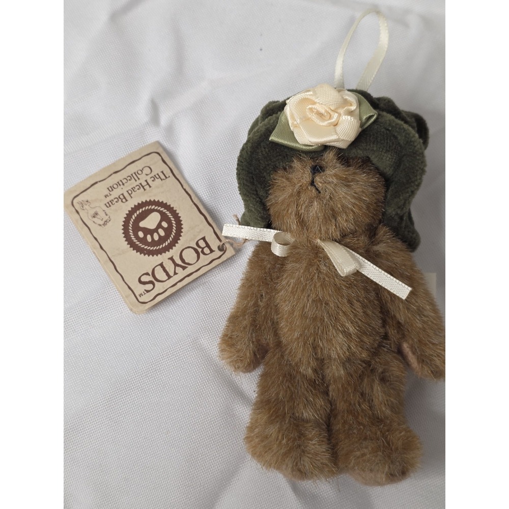 Plush teddy bear ornament, Boyds Bears Rissy, with green knit hat and cream rose